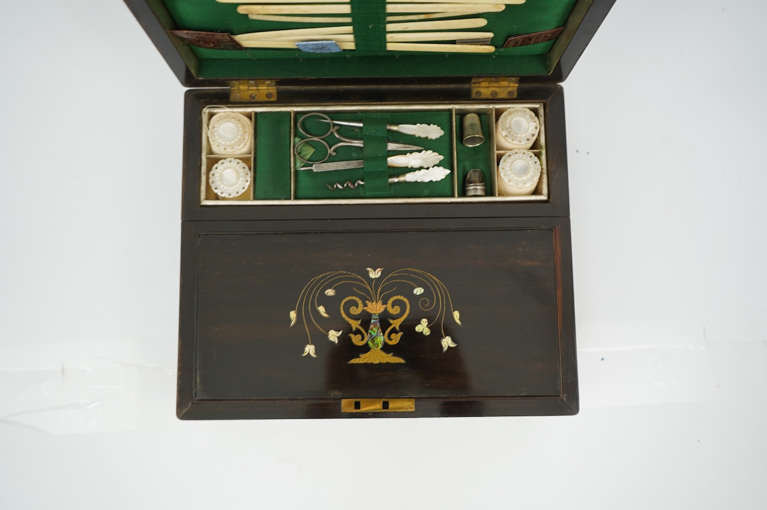 A mid 19th century rosewood writing and sewing box
